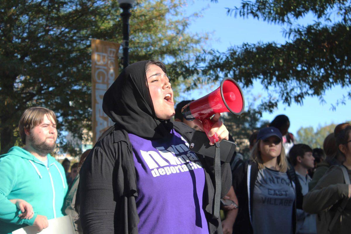 Students stood on Pedestrian Walkway protesting the election of Donald Trump on Nov. 10, 2016.