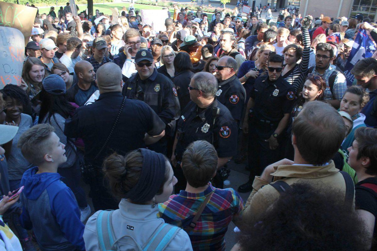 Students stood on Pedestrian Walkway protesting the election of Donald Trump on Nov. 10, 2016.
