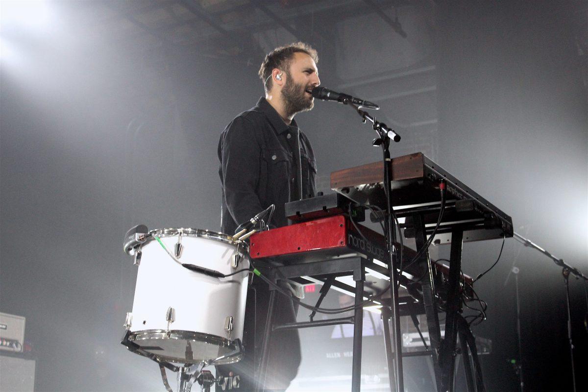 Kelcey Ayer of Local Natives sings to the crowd while playing the keyboard at The Mill and Mine.