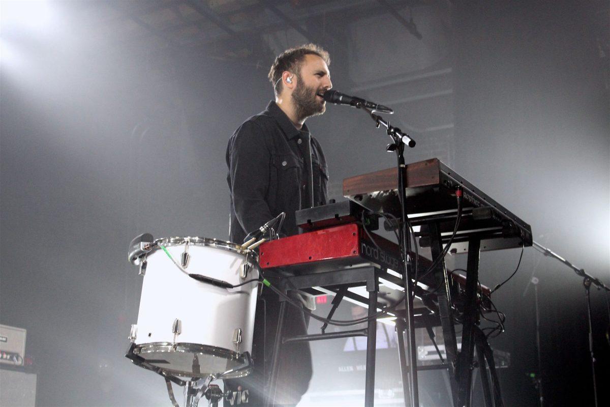 Kelcey Ayer of Local Natives sings to the crowd while playing the keyboard at The Mill and Mine.