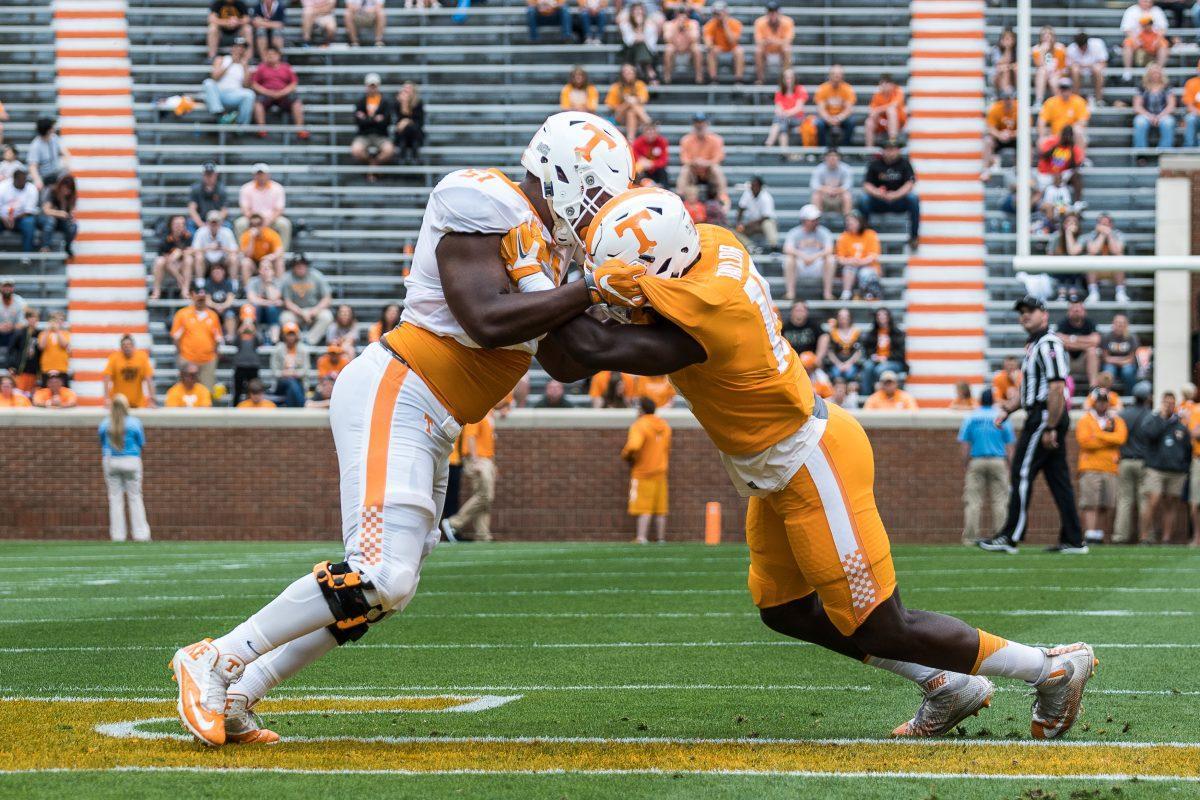 Drew Richmond, #51, and Darrell Taylor, #19, of the Tennessee Volunteers during the spring Orange and White game at Neyland Stadium on April 22, 2017.
