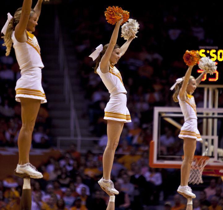Cheerleaders are raised up during an intermission during a basketball game on Saturday, Feb. 26., 2011. Members of the cheerleading squad are involved with almost every sport on campus and get involved outside the events as well.