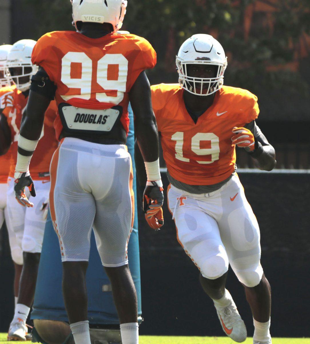 Jonathan Kongbo, #99, and Darrell Taylor, #19, during practice on Aug. 28, 2018 at the Anderson Training Center.