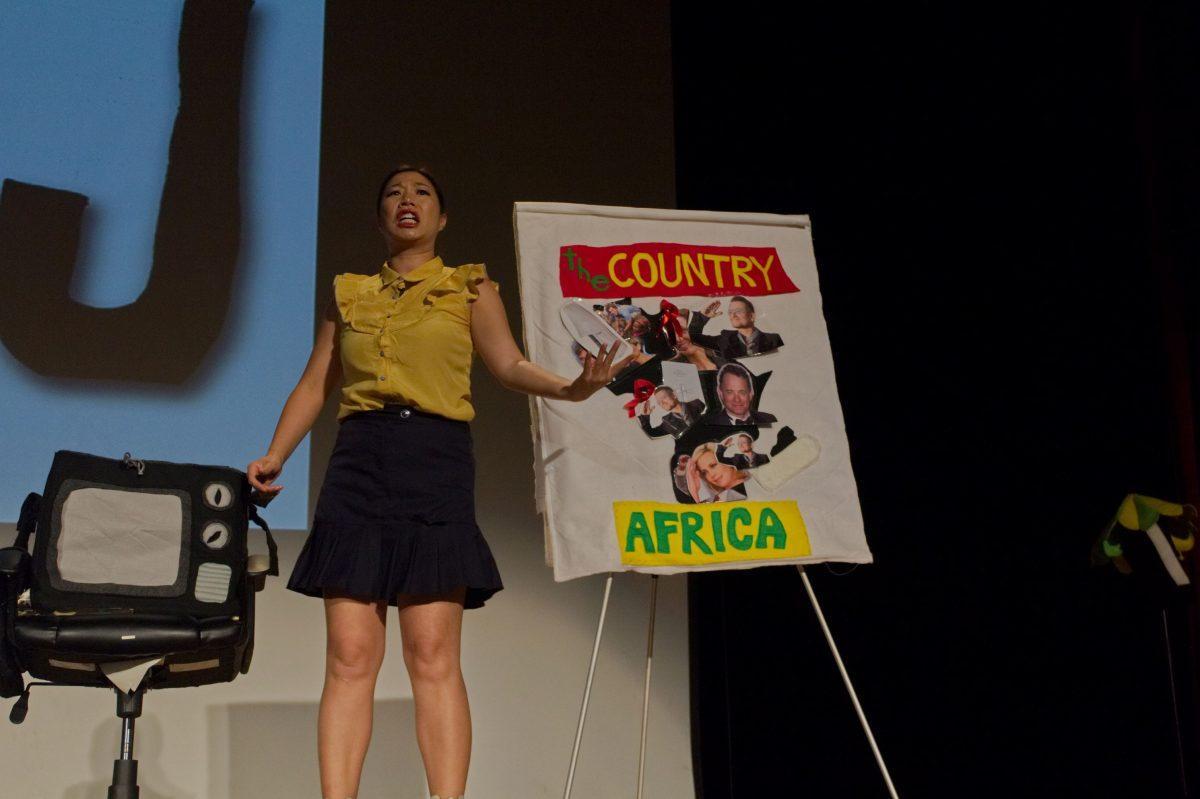 Kristina Wong fills a map of Africa with various people and objects associated with parts of the country on Sept. 11, 2018.