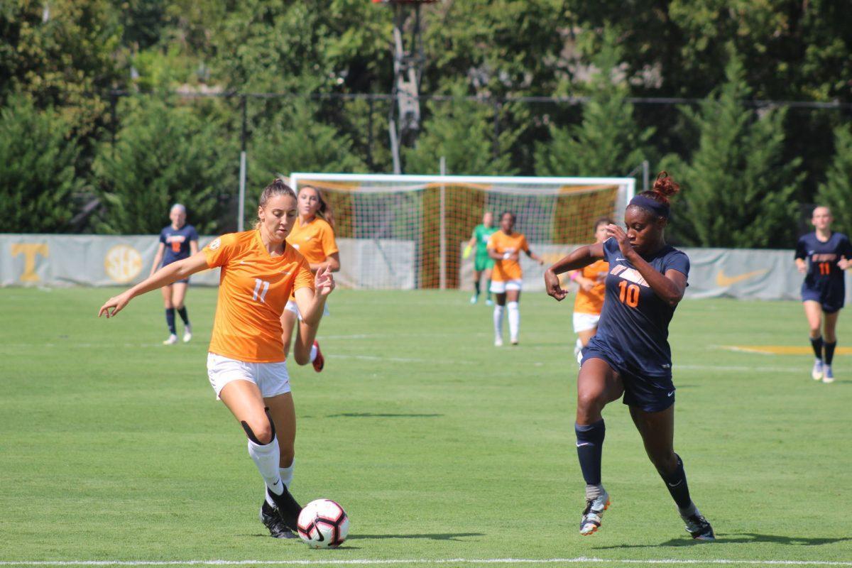 McKinley Burkett (11) for Tennessee dribbles past a UT-Martin defender in their contest on Sept. 2, 2018