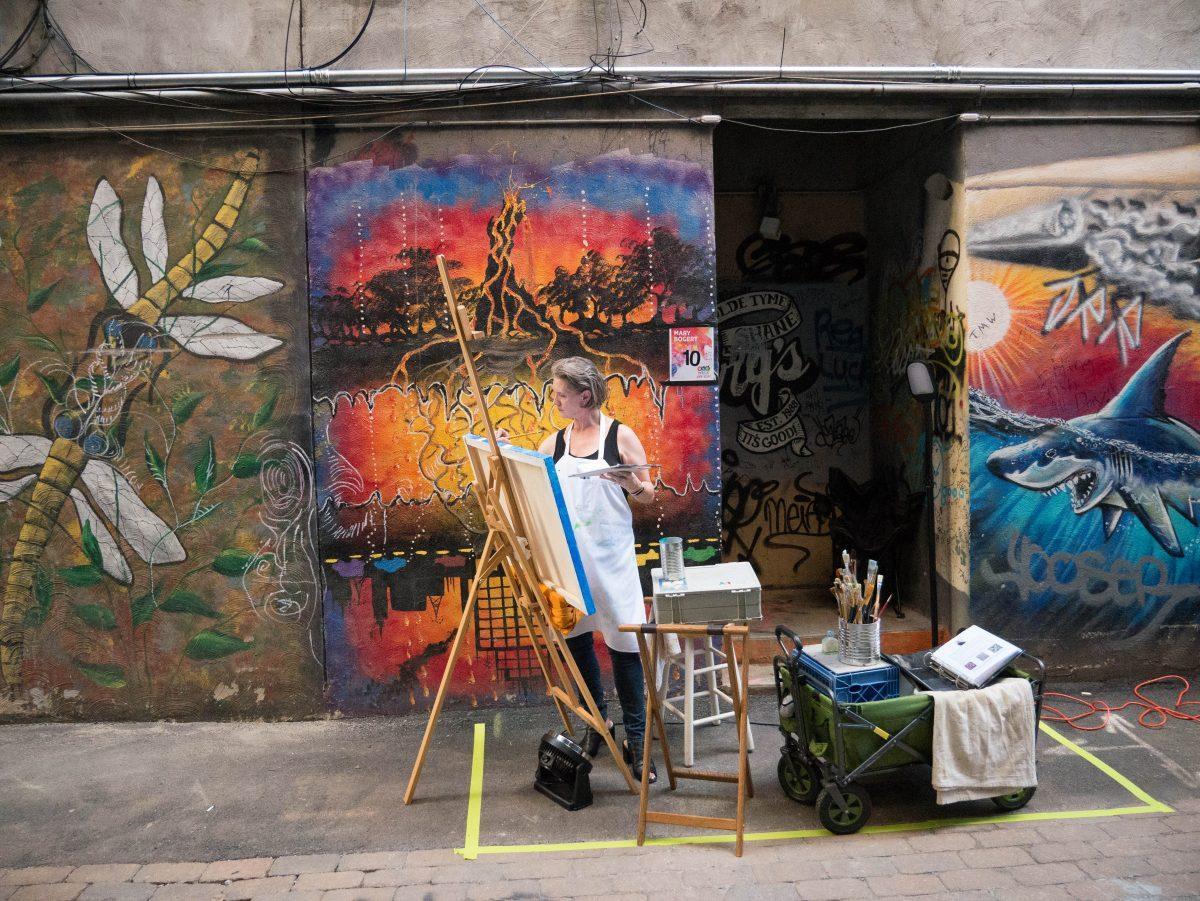 Artists were given a 3 hour time period to complete a large scale piece of art during the First Friday competition in Strong Alley on Sept. 7, 2018. 