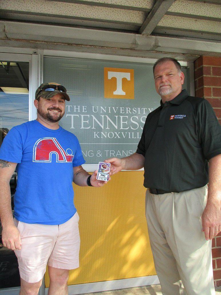The caption should say:Mr. Mark Hairr, Director of Parking and Transit services is presenting the Purple Heart permit to John Thomas Pontiff.