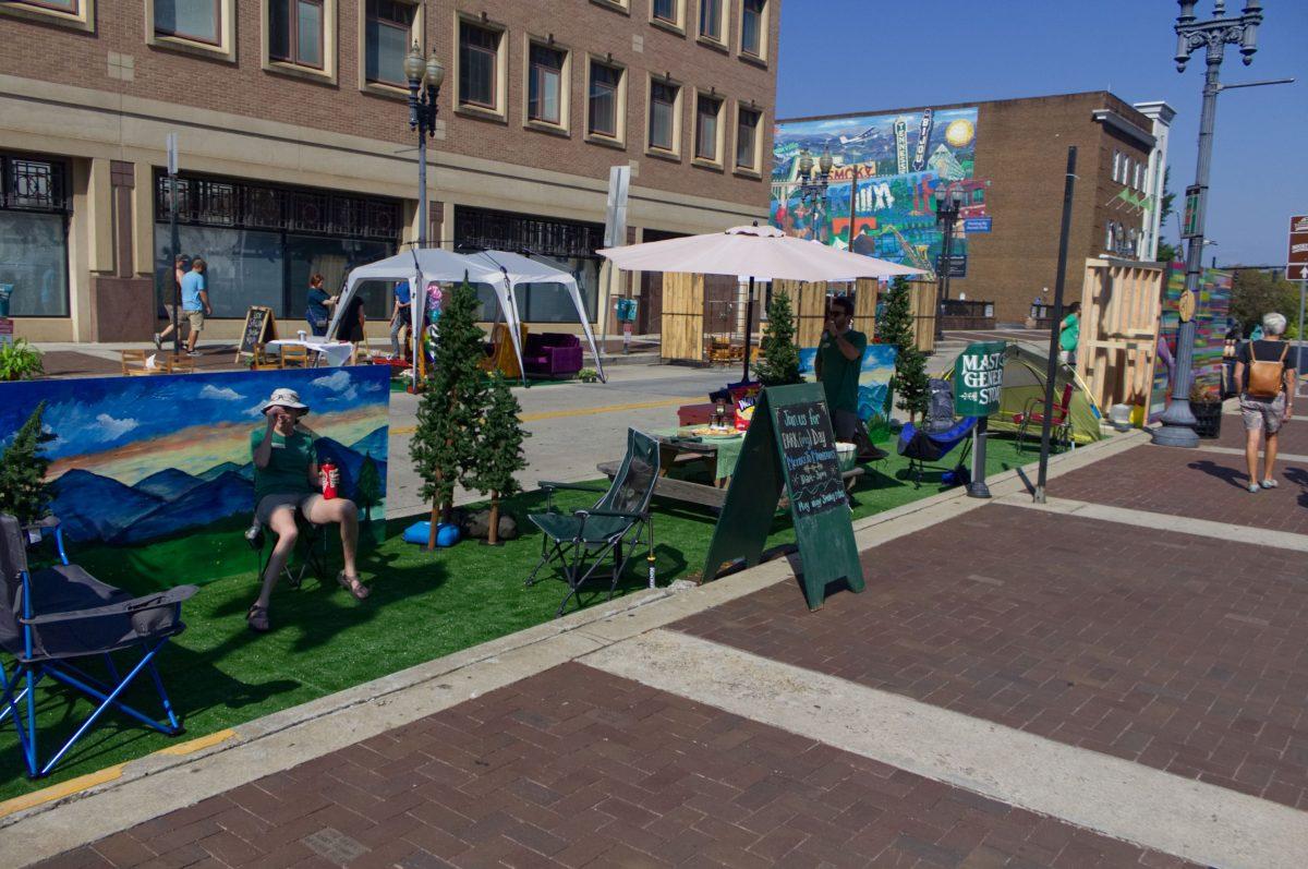 The "From Meters to Mountains" Booth is set up with camping gear on Gay Street for Park(ing) Day on Sept. 21, 2018. 