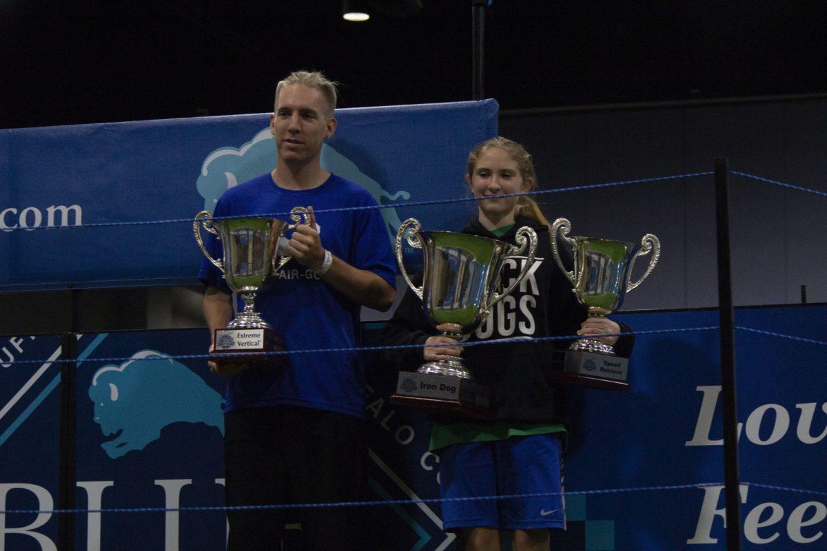 Dane Seidlitz and Sydney Mackey pose with their trophies from the Dock Dogs 2018 World Championship.