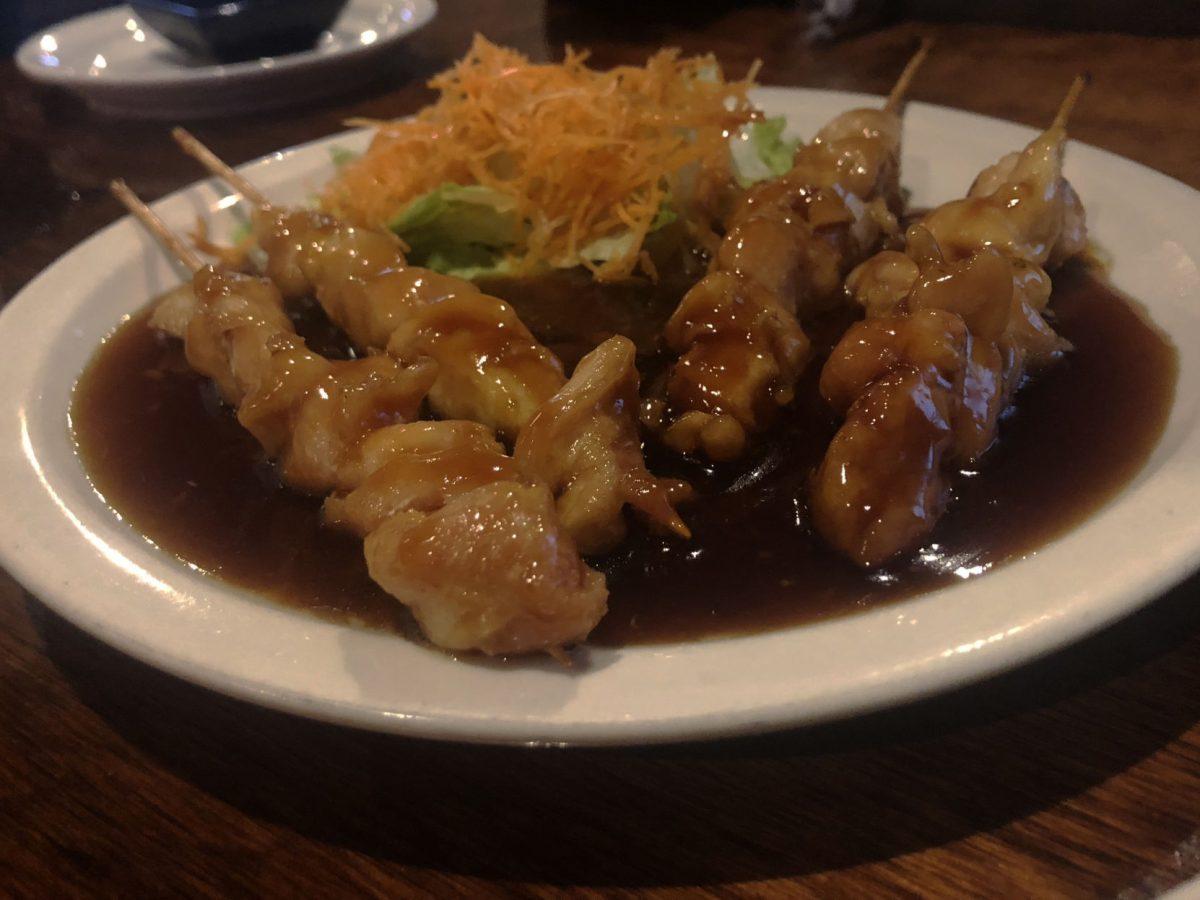 One of Anaba's appetizers is the yakitori, a chicken skewer with seasoning.