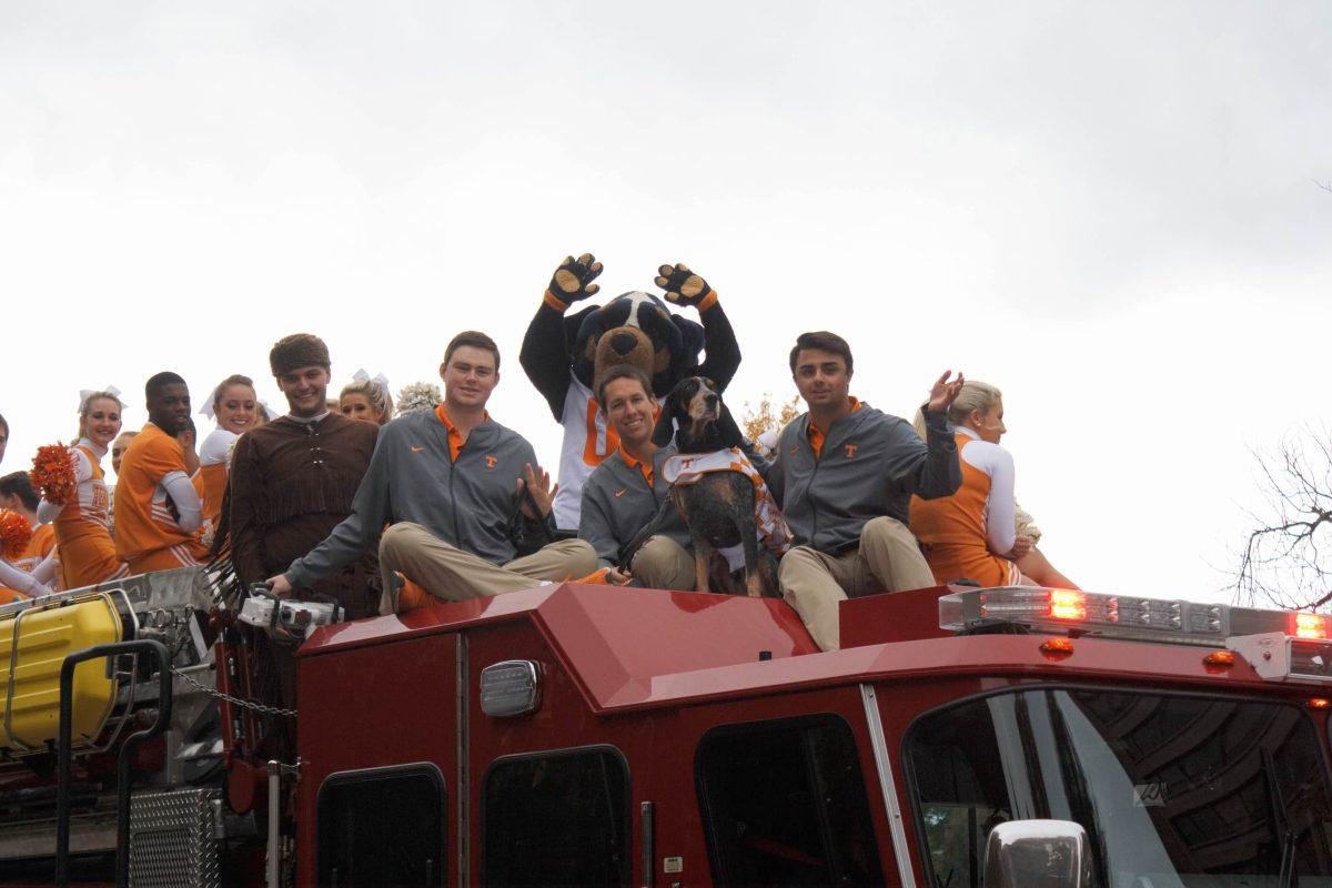 UT Cheerleaders and Smokey appear in the Homecoming Parade.