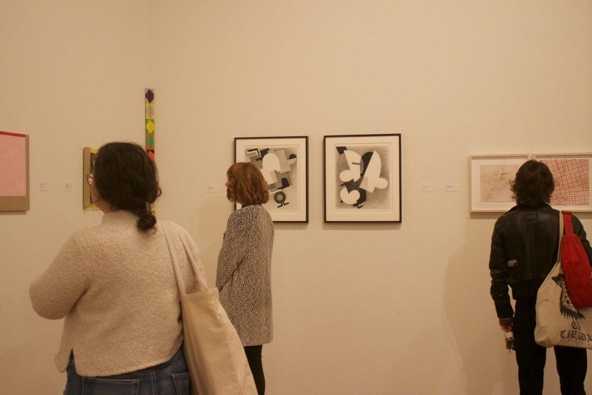 Students attend the opening night of the Blurring Boundaries exhibit in the Ewing Gllery in the Art and Architecture Building on Nov. 15, 2018. 