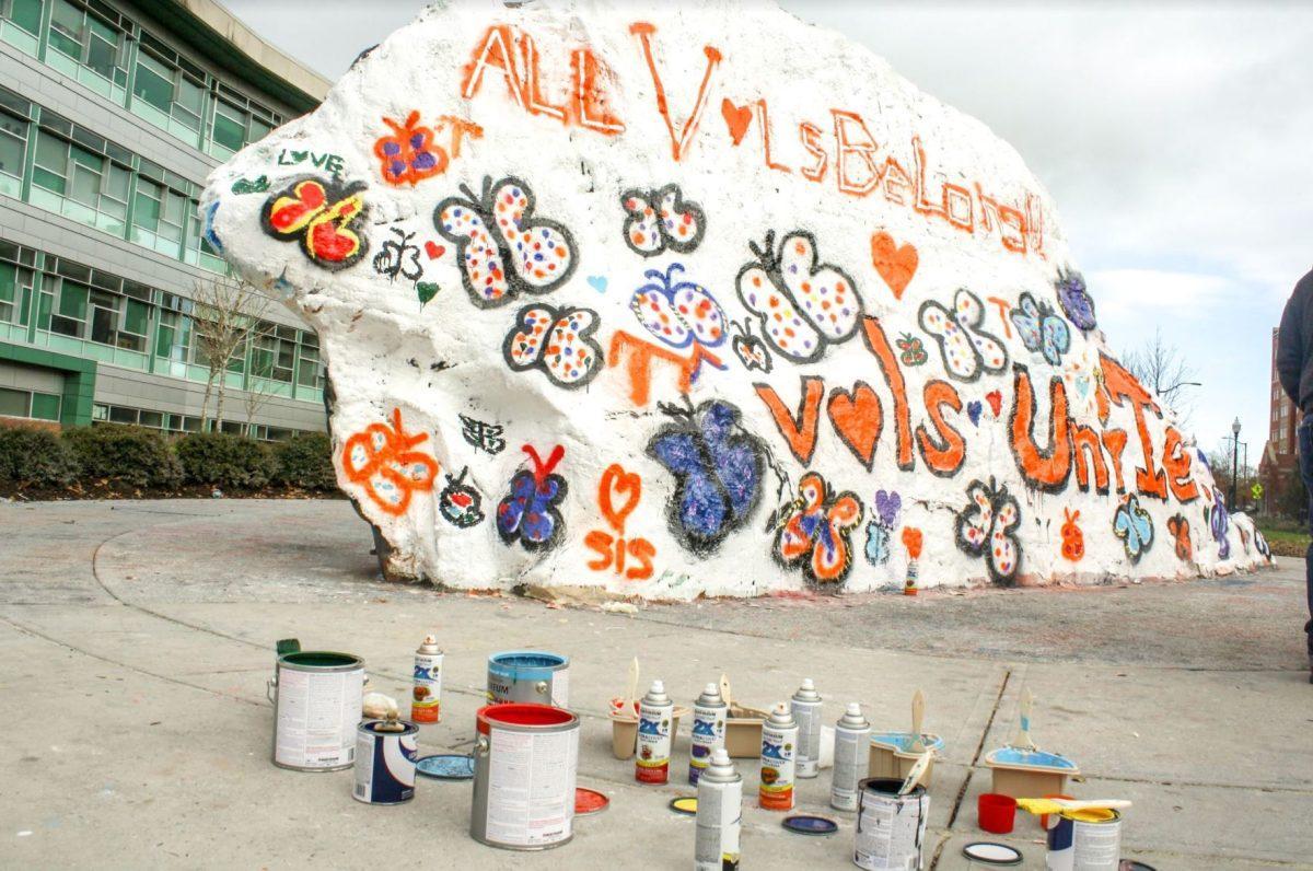 Students, faculty and administration gathered to paint the Rock on Dec. 5, 2018 leaving a message of "All Vols Belong!!! Vols Unite."