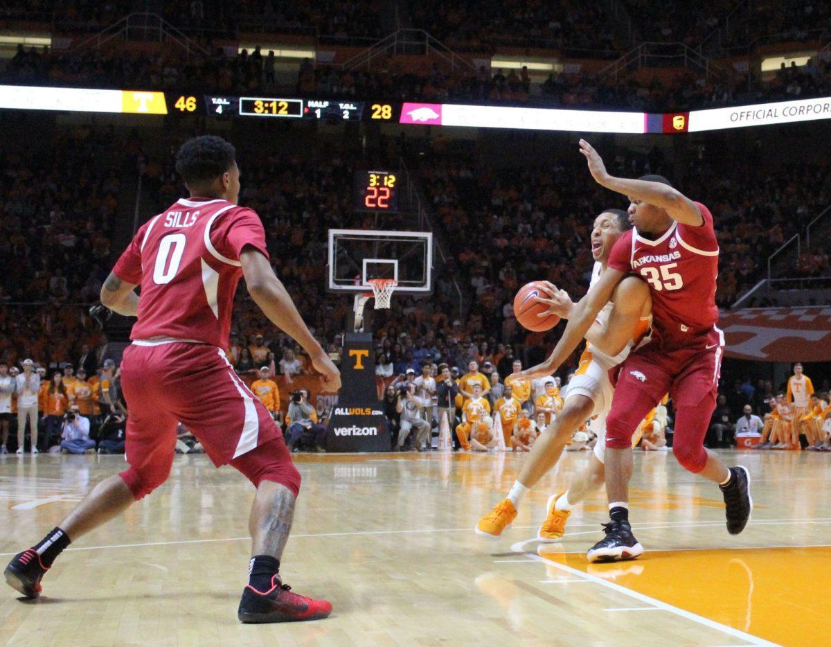 Grant Williams, #2, fights off Arkansas defender during game on Jan. 15, 2019 at Thompson-Boling Arena