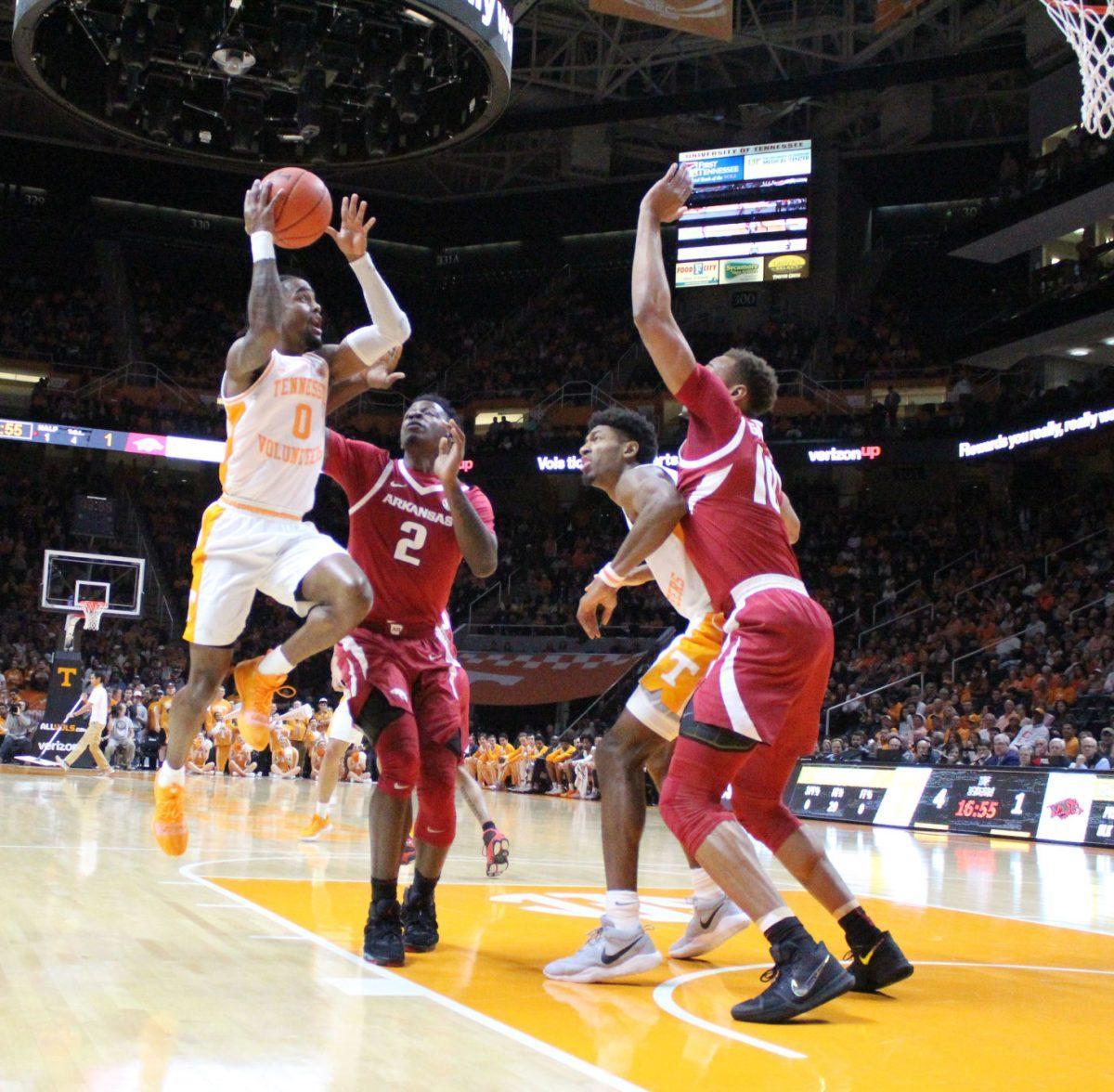 Jordan Bone, #0, goes up for a layup against Arkansas defenders during game on Jan. 15, 2019 at Thompson-Boling Arena