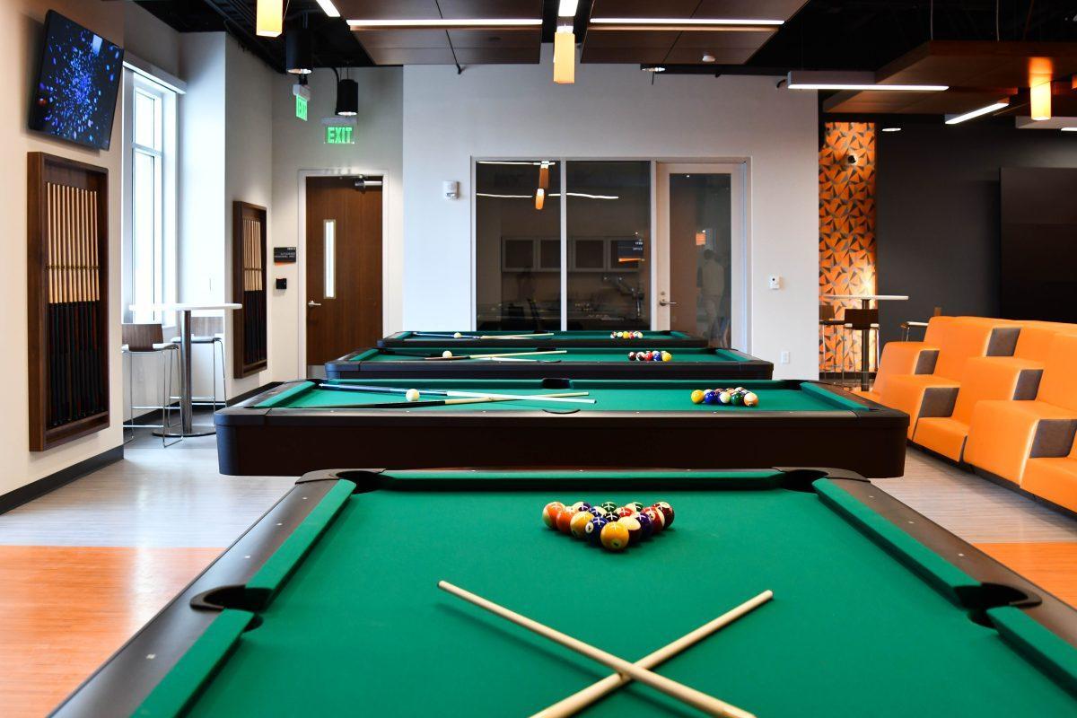 A game room complete with billiards, table tennis and space for other gaming sits behind the student organization suite. 