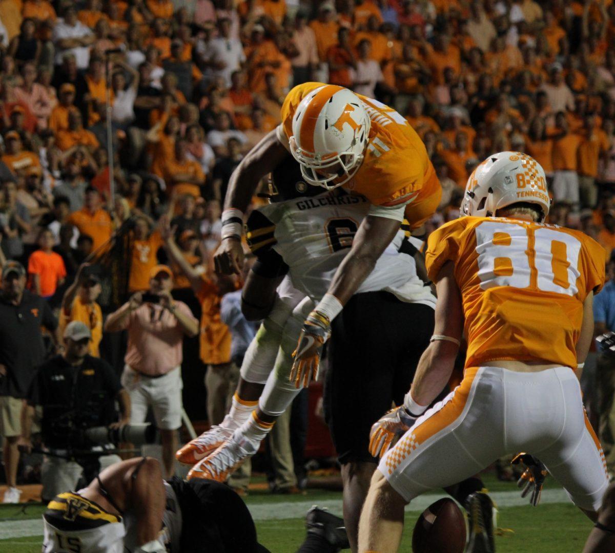 Josh Dobbs (11) fumbles the ball at the goal line while Eli Wolf (80) looks to land on the fumble in the end zone for a touchdown. 
