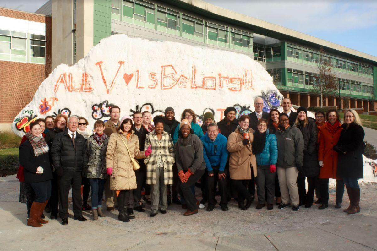 Students, faculty and administration gather on Dec. 5, 2018 to repaint the rock. 