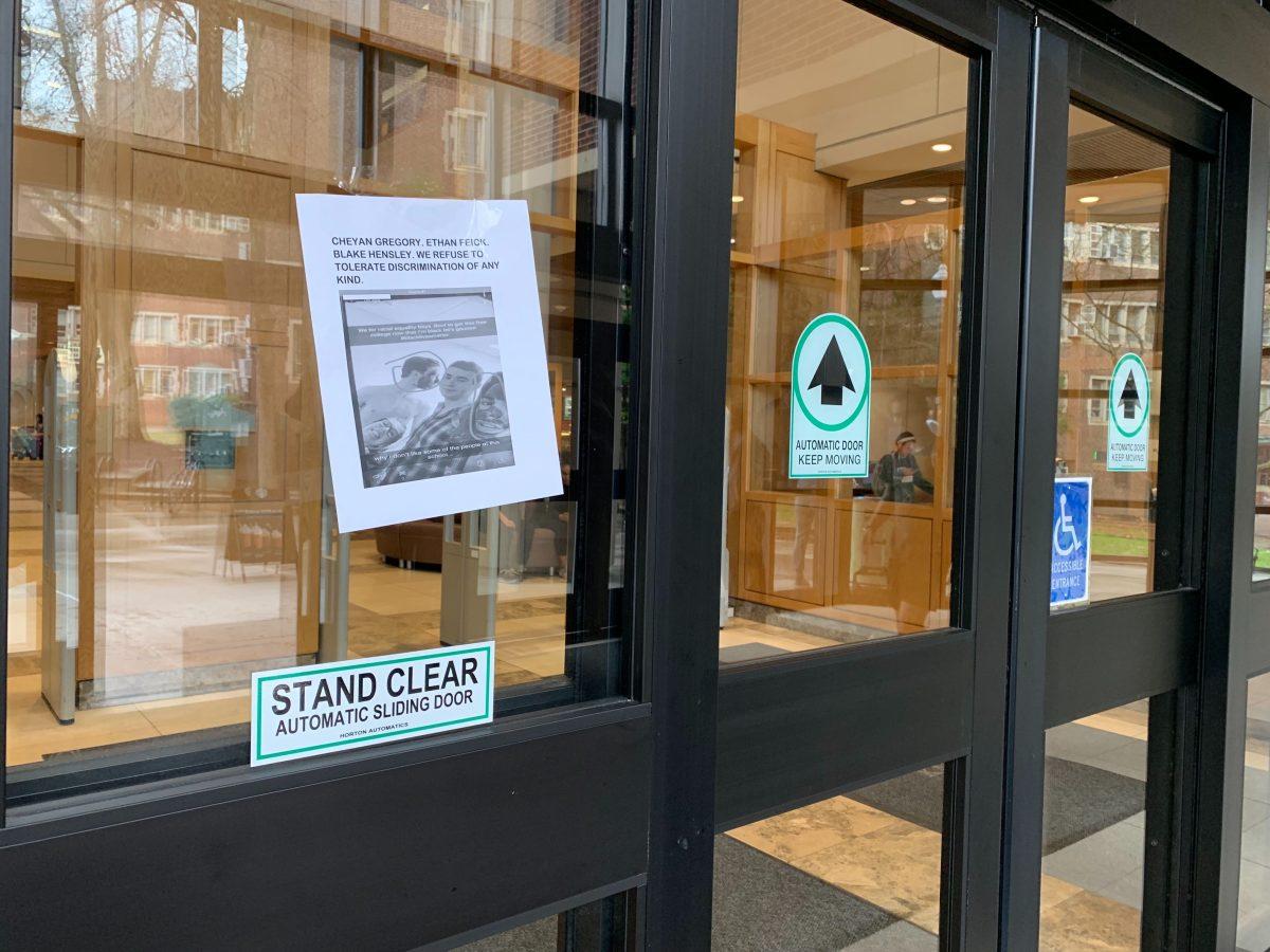 Flyers of a controversial blackface photo posted around Hodges Library, identifying who they believe to be three of the four students involved, said, “We refuse to tolerate discrimination of any kind.”