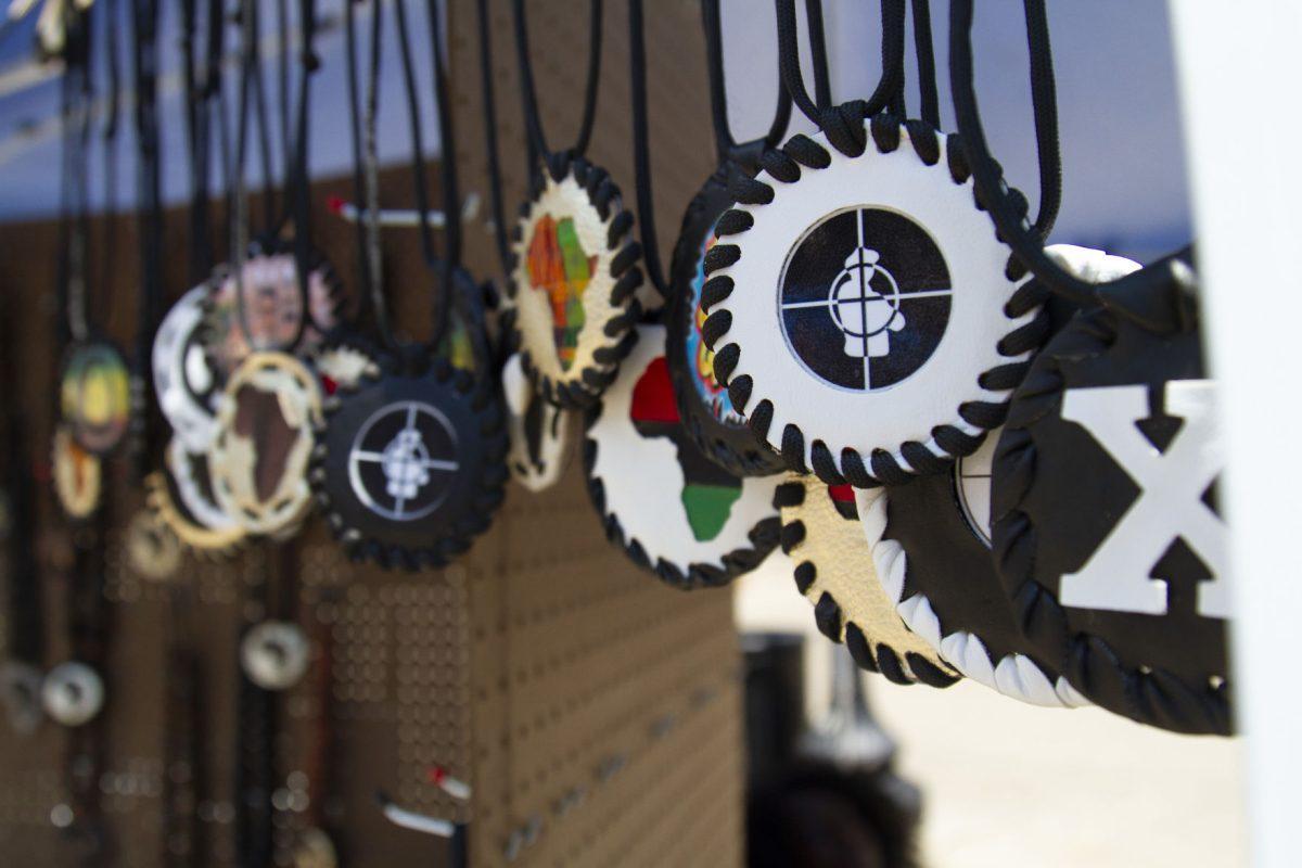 Handmade leather medallions hang on display in vendor Adande Cook's stall. 