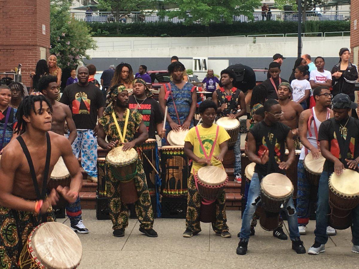 A member of Indigenous Vibes performs a drum solo - his hands moving so quickly, they seem to blur.