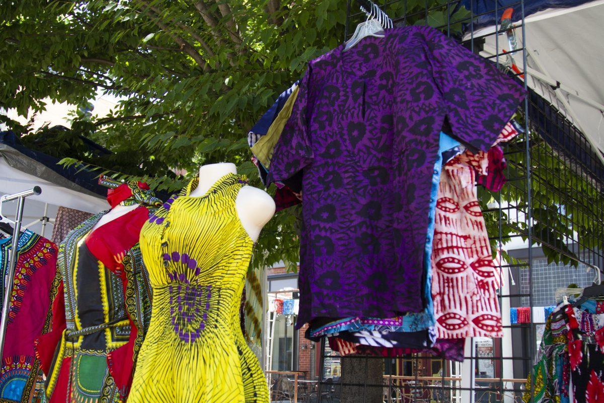 Brightly-colored African-style clothes for sale at the Kuumba Festival Open Marketplace. 