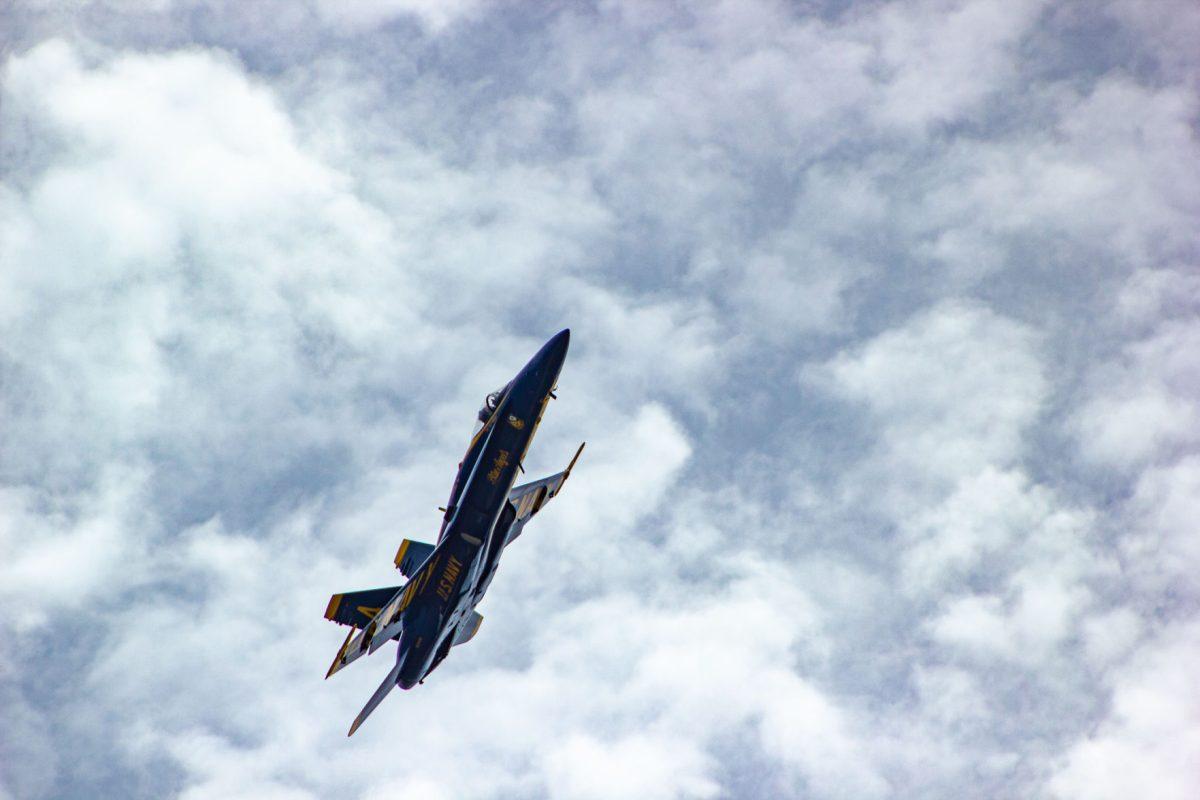 Blue Angels plane 4 performing a manuever during practice in Fort Pickens, Florida - June 26, 2019.
