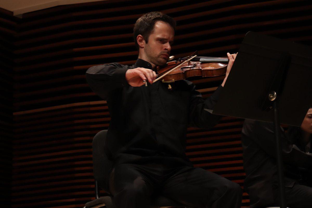 Centering himself on his violin's rhythm, Kevin Class demonstrates his aptitude at the Faculty recital on Friday, September 20, 2019.
 
