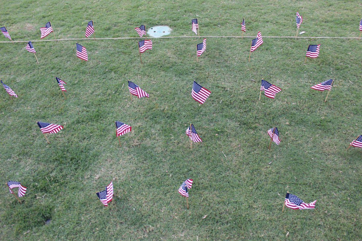 UT students place 2,977 flags in the lawn next to HSS amphitheater on Tuesday, September 10, 2019 representing the lives lost 18 years ago during the September 11 terrorist attacks.