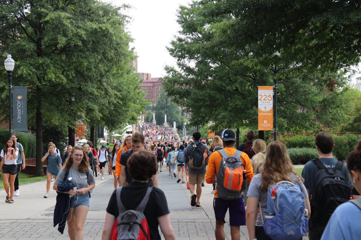 Pedestrian Walkway buzzes with life as UT students trek along the well-worn walkway between classes, dorms and other locations on campus. 