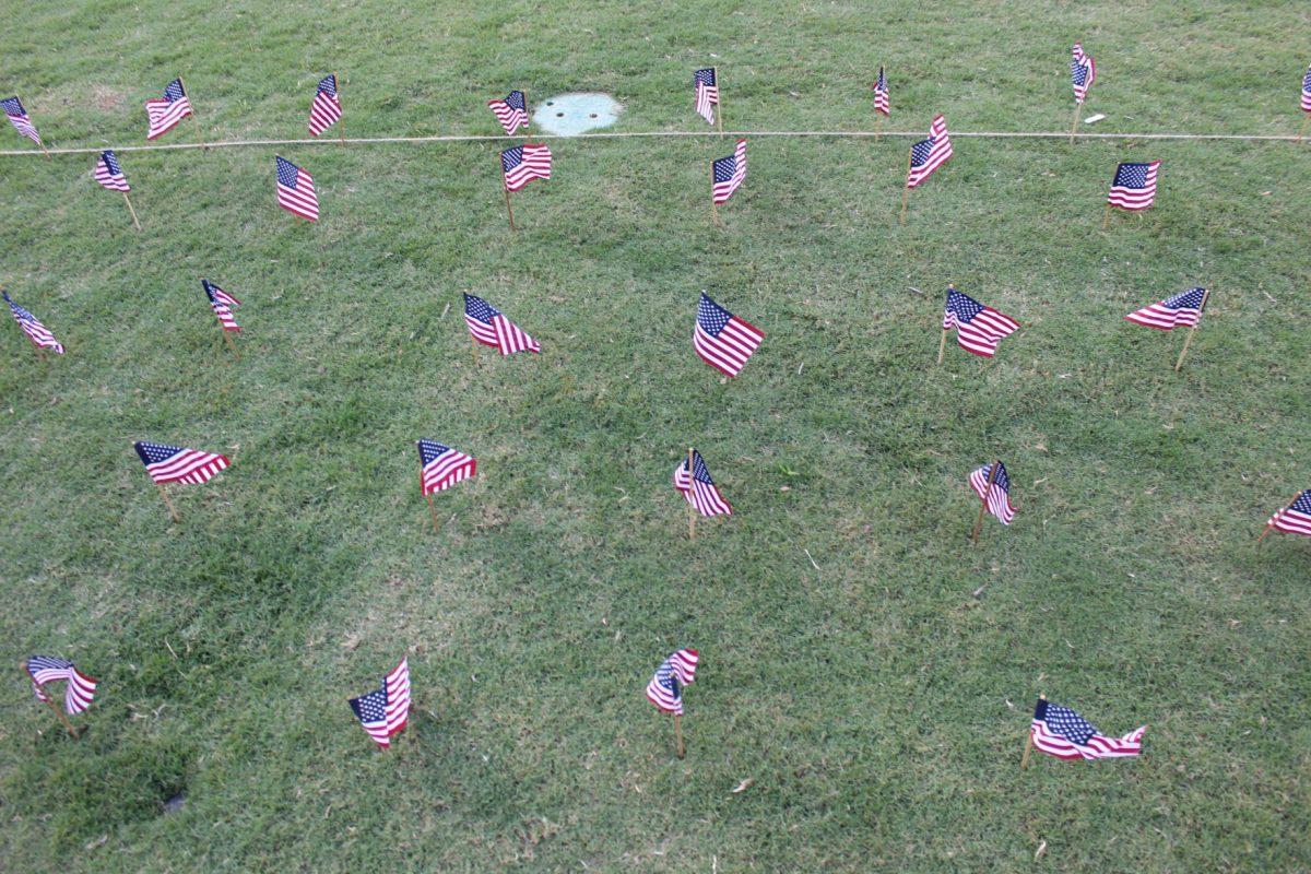 UT students place 2,977 flags in the lawn next to HSS amphitheater on Tuesday, September 10, 2019 representing the lives lost 18 years ago during the September 11 terrorist attacks.