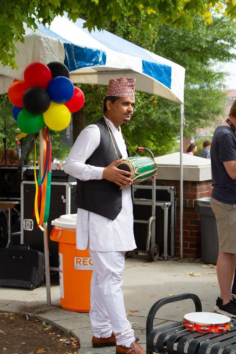 A drummer apart of the Nepali Student Association plays at the 2019 International Festival on Ped Walkway on Friday, September 27.