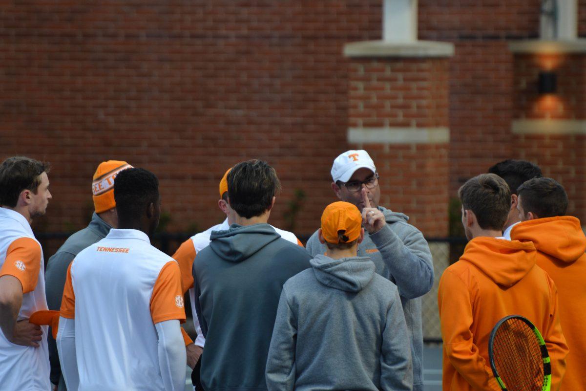 Men's Tennis head coach, Chris Woodruff, speaks to his team before the singles rounds against Texas A&amp;M on Mar. 22, 2018. 