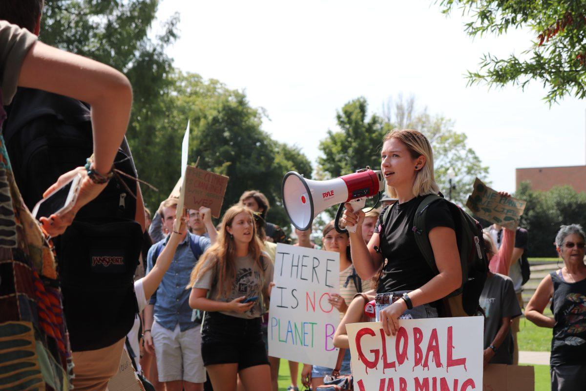 Senior studying environmental and soil science Kendall Wimberley rallies protestors for the march against climate change on Friday, September 20, 2019. 