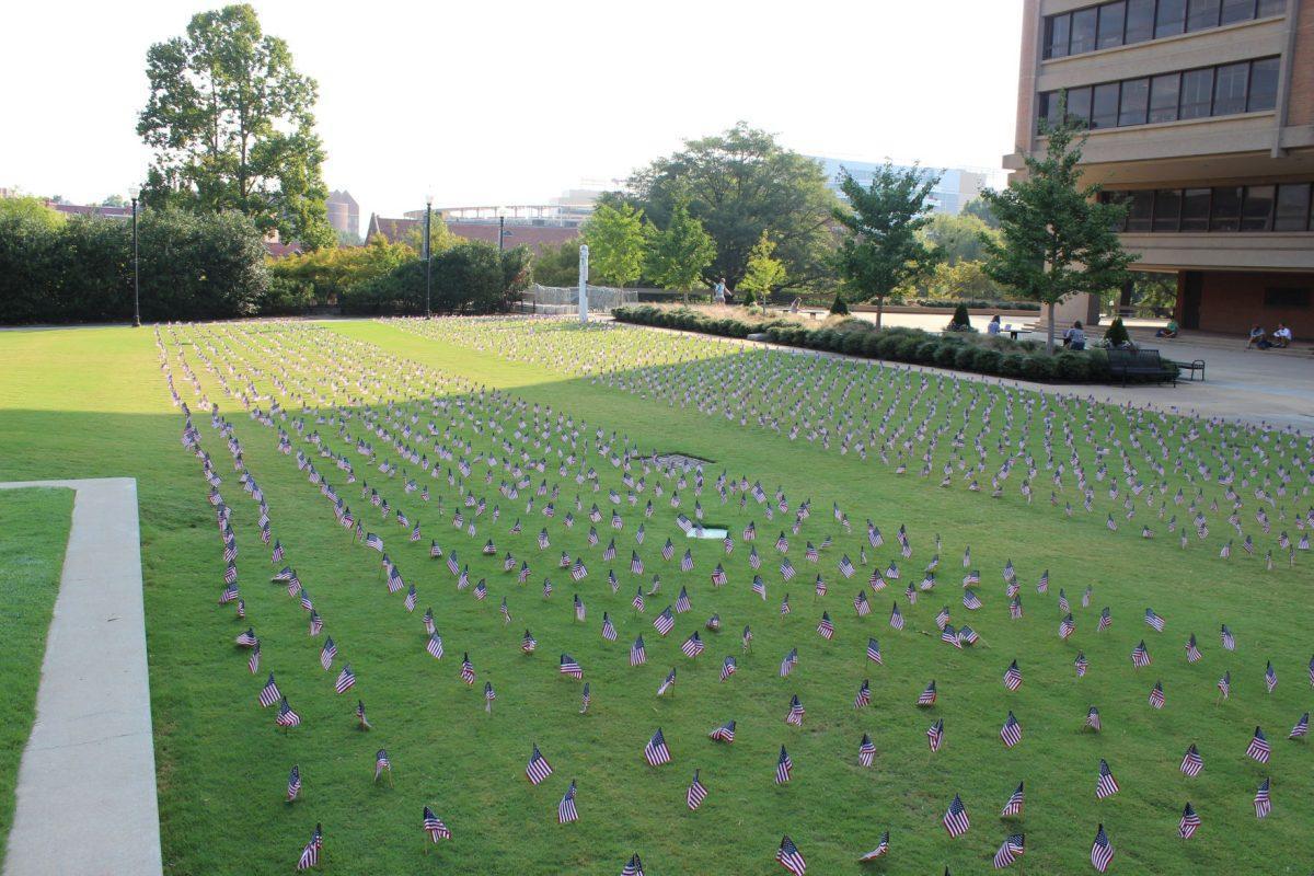 The UT community could see the memorial comprised of 2,977 flags placed by the Young Americans for Freedom UT chapter to honor the lives lost on September 11, 2001 as they pass by HSS amphitheater lawn.