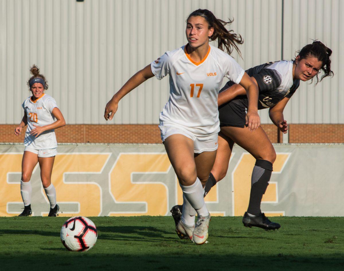 Amy Thompson, #17, dribbles past defenders during game against Vanderbilt on Oct. 7, 2018 at Regal Soccer Stadium.