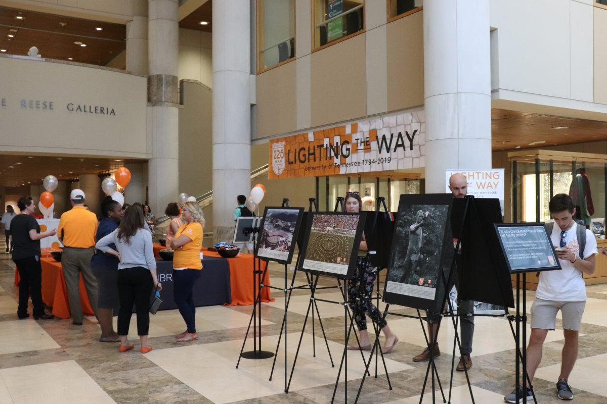 Students, faculty and staff look through archival photos of UT over the last 225 years at Hodges Library 'Lighting the Way' Exhibit on Tuesday, September 10, 2019. 