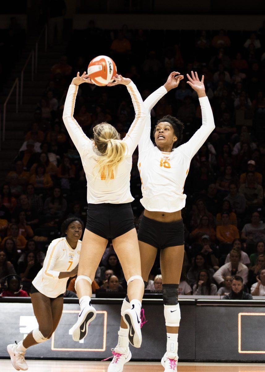 Tennessee's Sedona Hansen (11) sets the ball as Addisyn Rowe (16) fakes a play during the Tennessee and Kentucky volleyball game on Thursday, October 17, 2019 Thompson-Boling Arena at the University Tennessee, Knoxville.