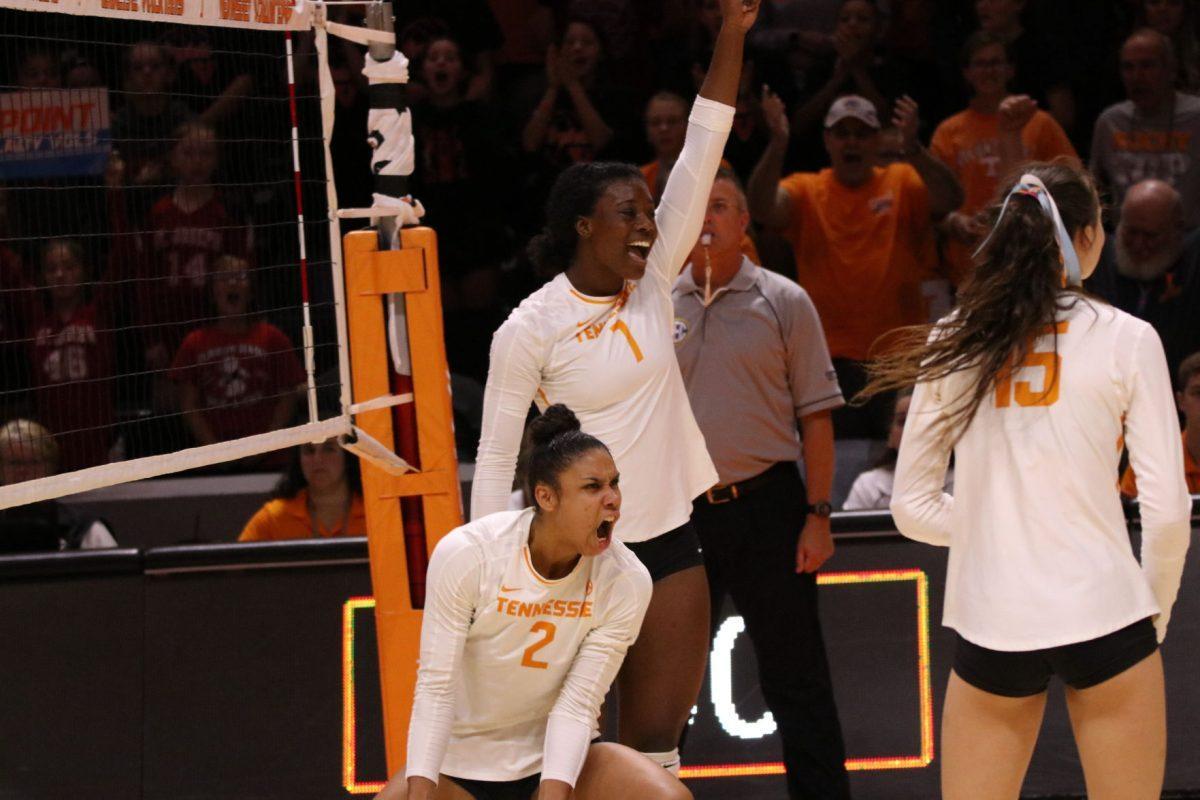 Lady Vols volleyball players, Alyssa Andreno (#2) and Morghan Fingall (#7), celebrate as they score a point against Mississippi State at Thompson-Boling Arena on Sunday, October 13, 2019.
 