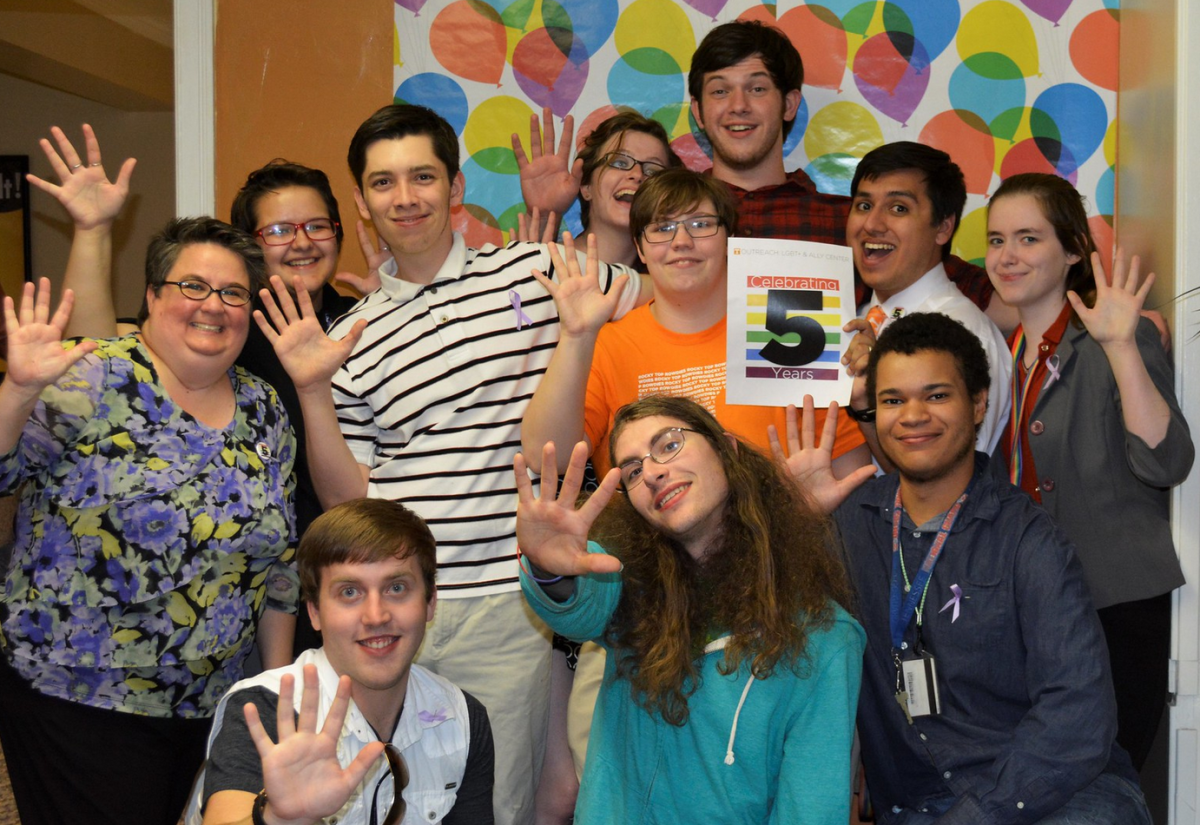 Donna Braquet and former students celebrating the fifth year anniversary of the OUTreach: LGBT &amp; Ally Resource Center in February 2015.