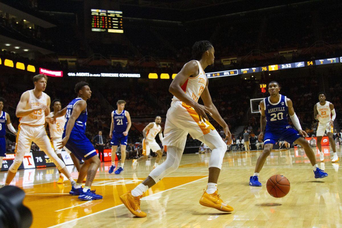 Tennessee guard Jalen Johnson, #13, dribbles the ball while sizing up an opponent in the game against UNC Asheville at Thompson-Boling Arena on Tuesday, November 5, 2019.