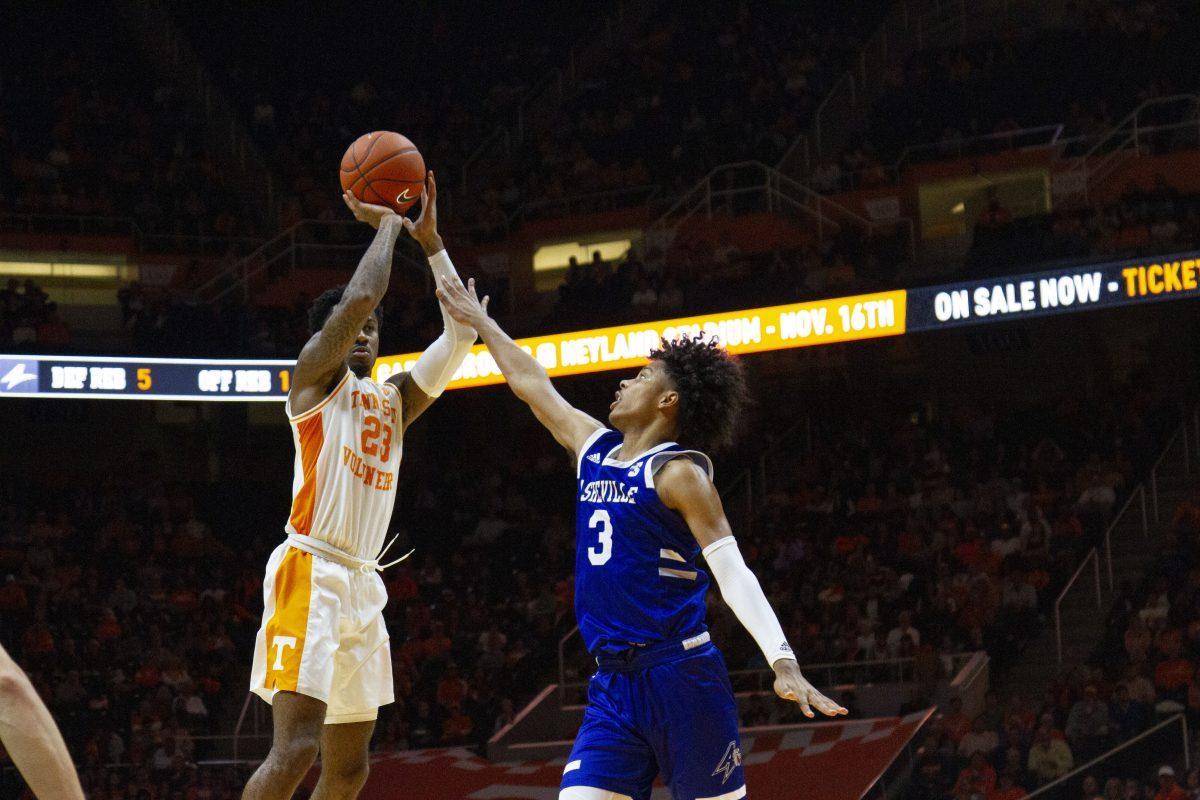 Jordan Bowden, #23, prepares to shoot the basketball over UNC Asheville defender during the game in Thompson-Boling Arena on Tuesday, November 5, 2019.