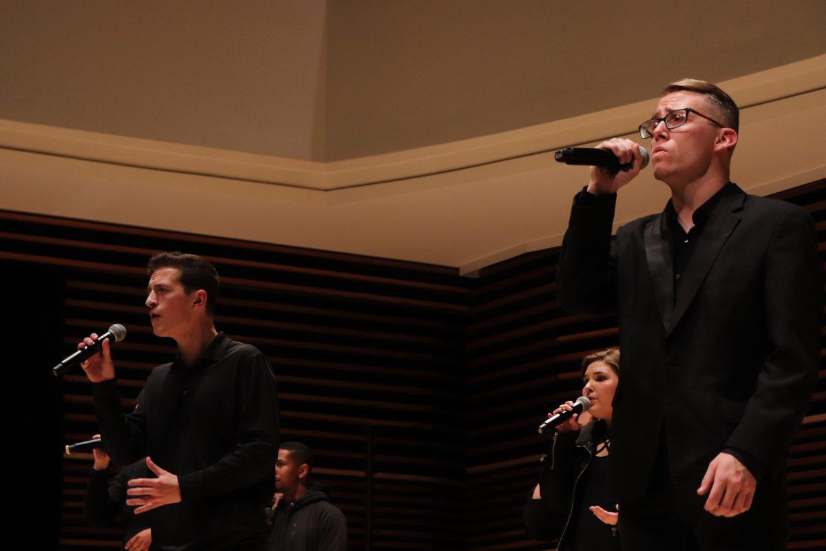 Leading their teammates at the UT Singers' Homecoming concert, Jack Rosamond(left) and Paul Davis(right) lend their vocals in a rendition of Rag'n Bone Man's "Skin."