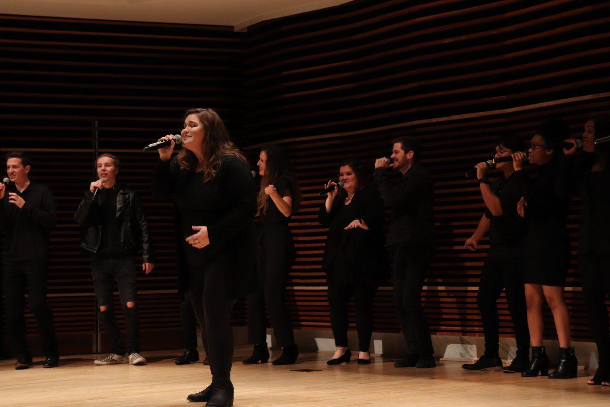 Performing alongside the support of her teammates, Ellie Smith takes center stage in her performance of Eric Carmen's "Make Me Lose Control," on Friday, November 1, 2019.