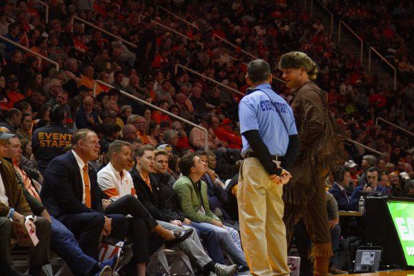 Junior studying psychology Cainan Phillips dressed as Davy Crockett and City Mayor Glenn Jacobs (left) talk during the UT vs. Murray State Basketball game on Tuesday, Nov. 12, 2019 at Thompson-Boling Arena.