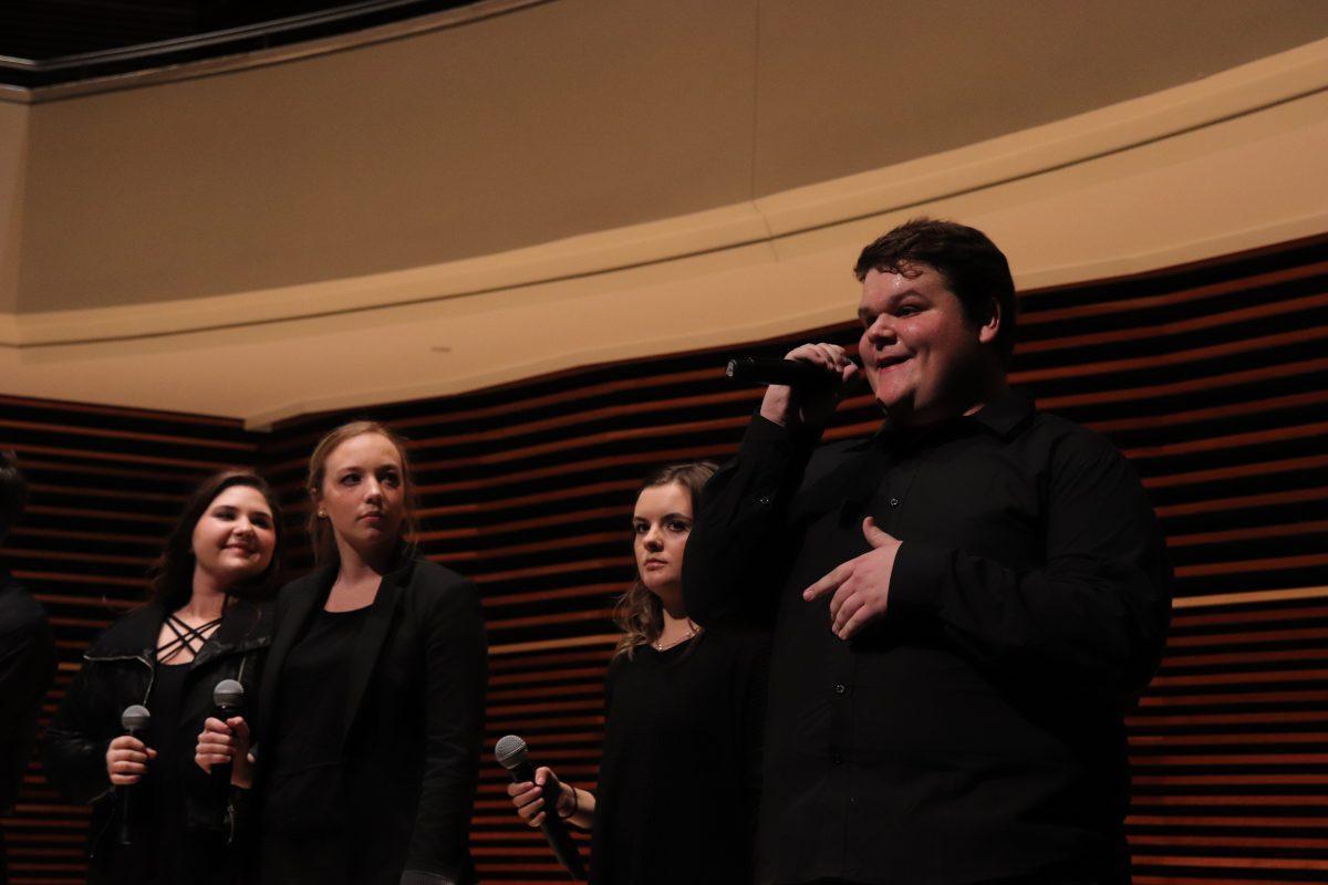 Vocalist Jackson Williams takes his turn introducing himself alongside his teammates after a successful opening performance on Friday, November 1, 2019.