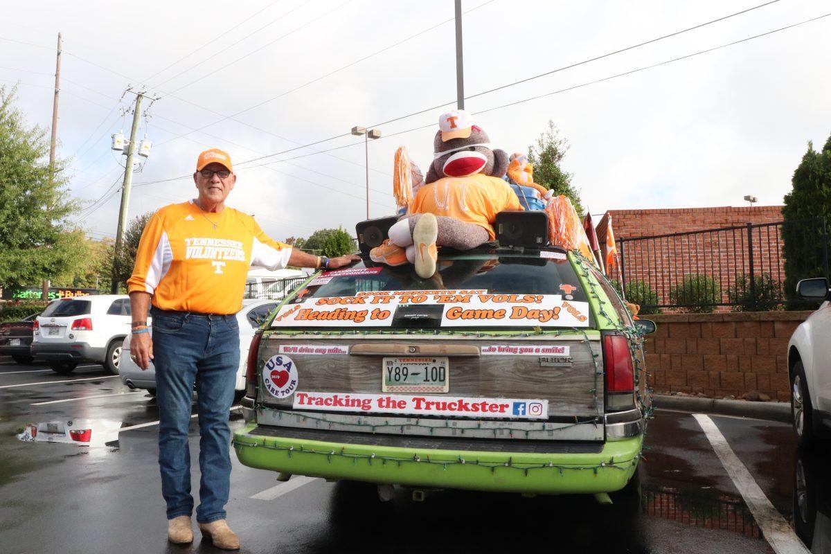Coach Dave Moore shows off his famous Truckster, a game day vehicle designed to offer opposing teams' fans rides around the university in the name of hospitality.