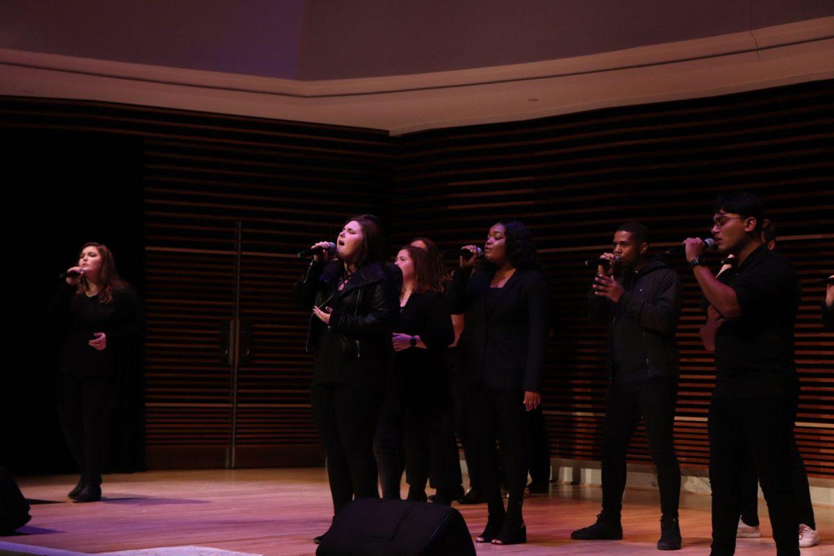 Ellie Smith takes center stage as Hannah Maner (far left) lends her vocals in their performance of Lauren Daigle's "You Say," during the Homecoming concert on Friday, November 1, 2019.