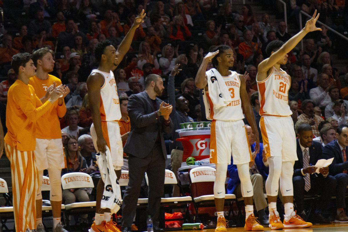 Tennessee teammates celebrate as the team shoots a three pointer in the game against UNC Asheville at Thompson-Boling Arena on Tuesday,November 5, 2019.