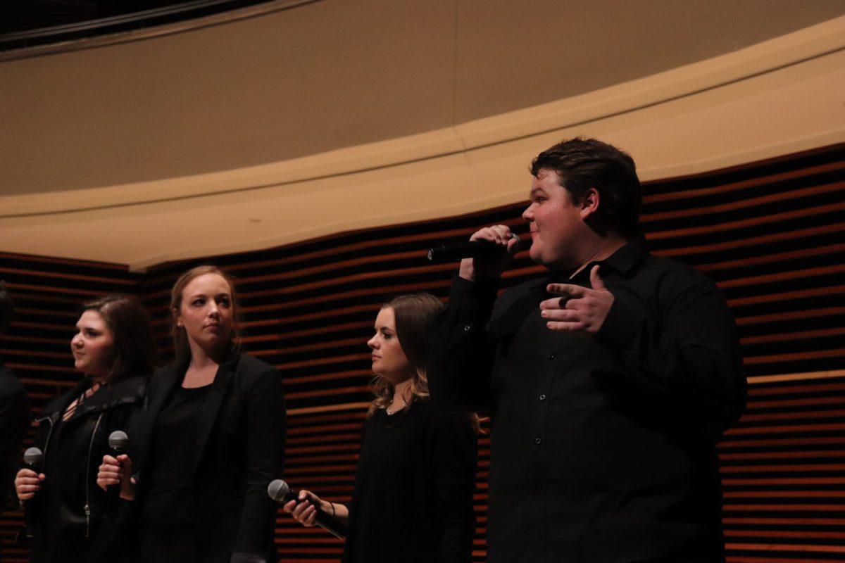 Vocalist Jackson Williams takes his turn introducing himself alongside his teammates after a successful opening performance on Friday, November 1, 2019.
